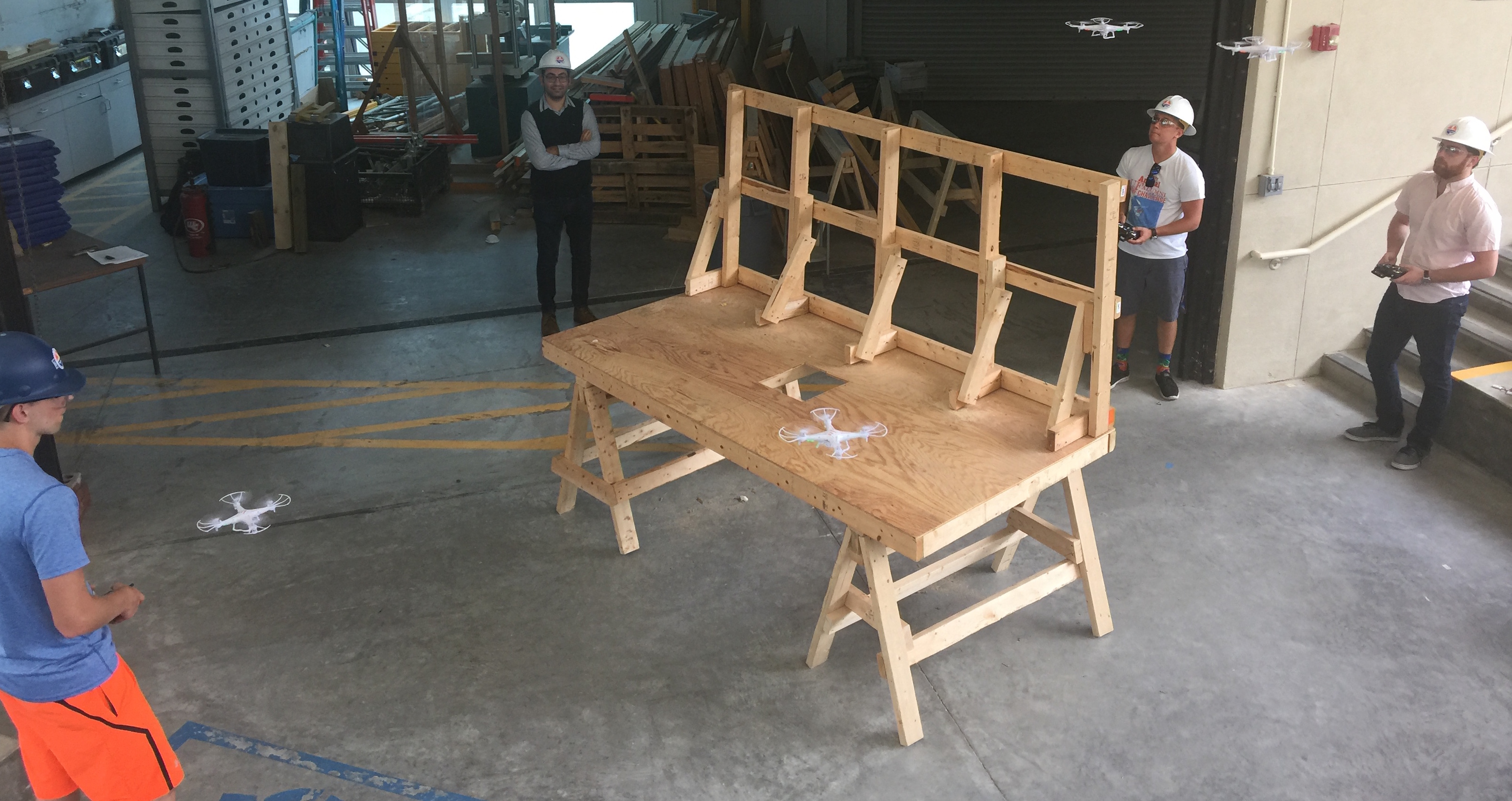 construction students fly drones in a classroom