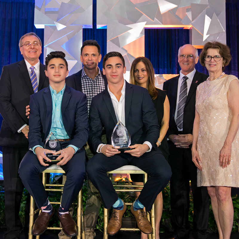 Photo of UF President Kent Fuchs, Bryce Benbasat, Steve Benbasat, Josh Benbasat, Dena Benbasat, Dr. Rowan Milner and Beth McCague