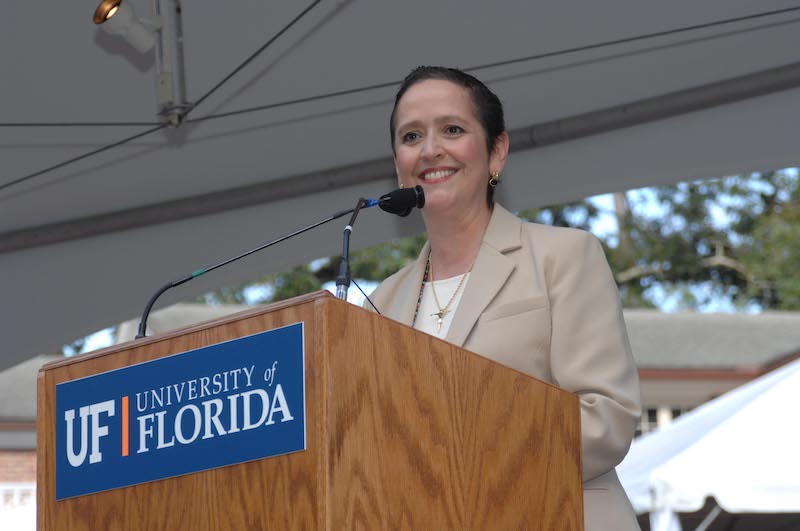 Patricia Telles Irvin at a lectern 