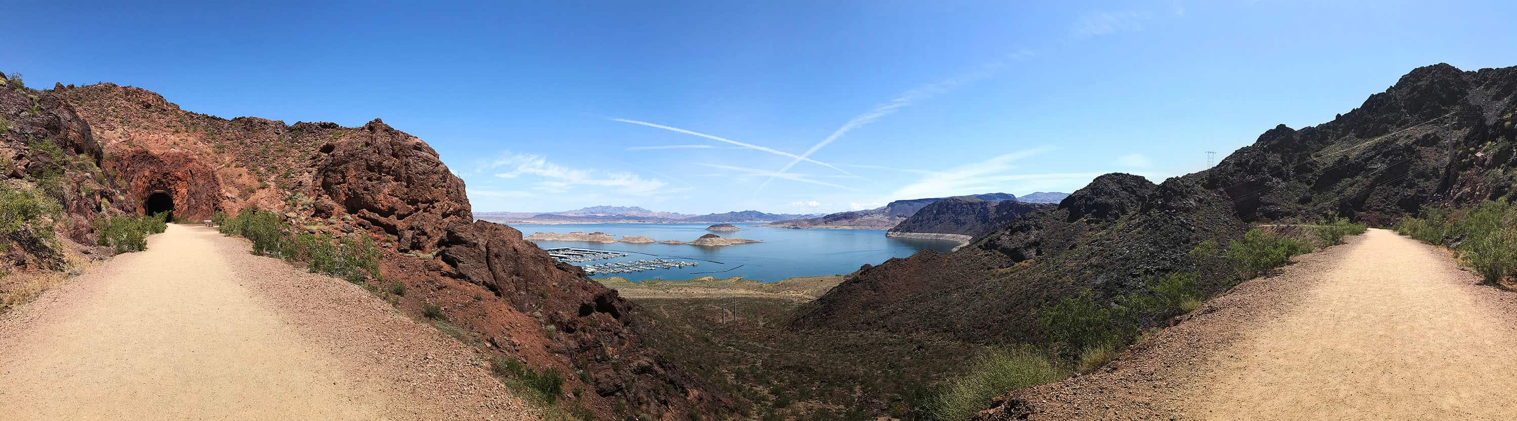 a panorama of a lake and road 